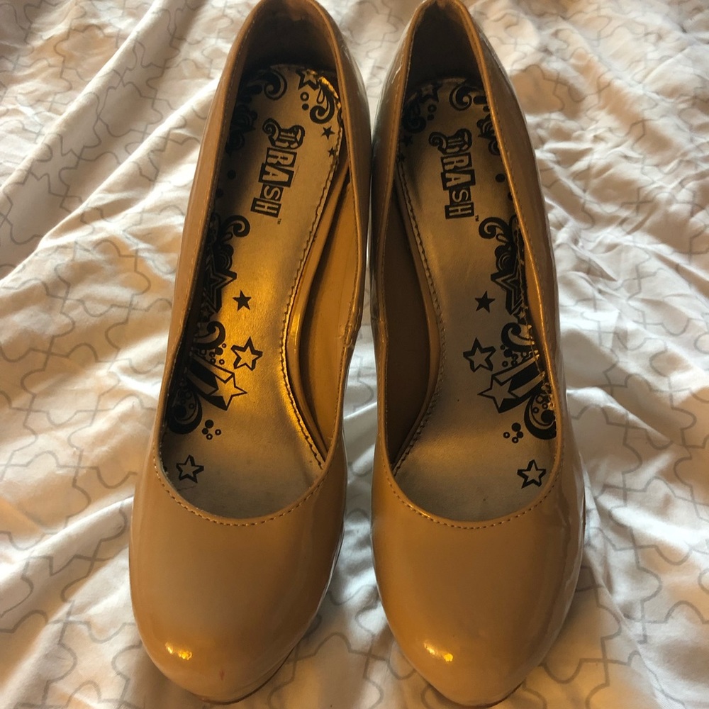 Brash patent leather nude heels